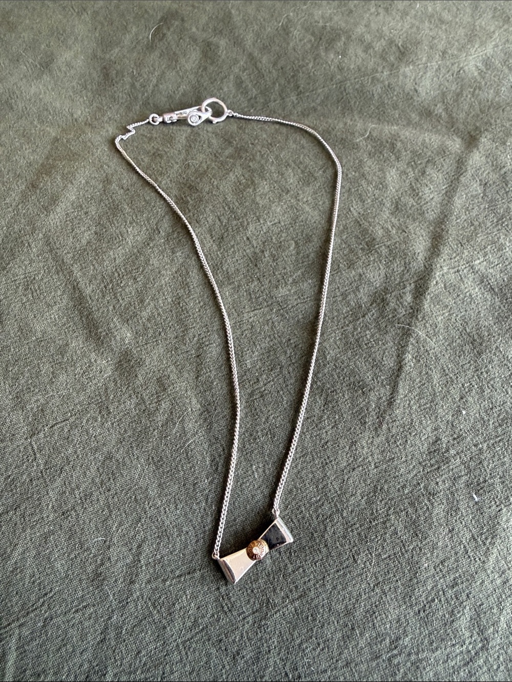 Henri Bendel Silver Bow Pendant Necklace
